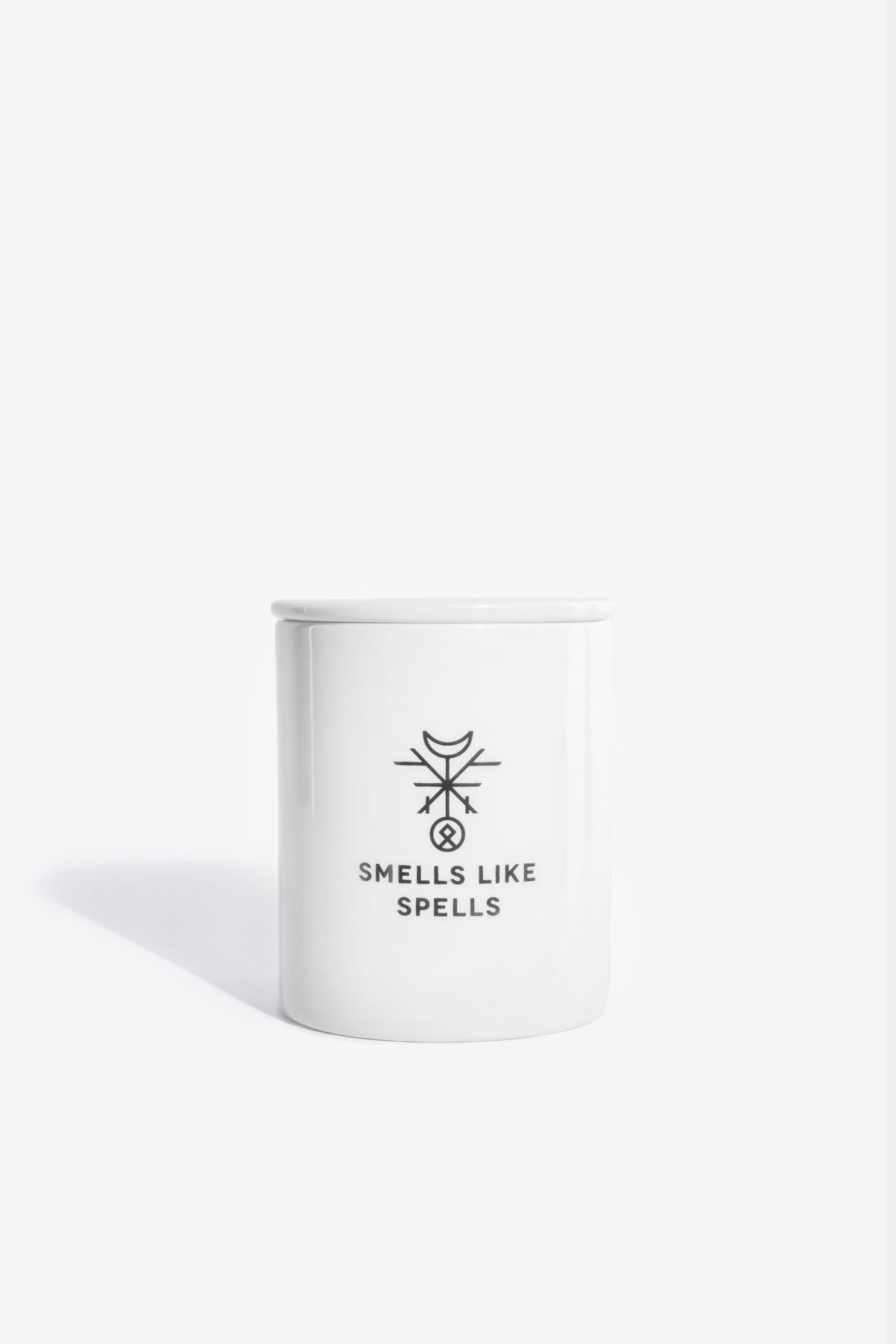 THE SUN Tarot candle, front view showing porcelain container and wooden wick