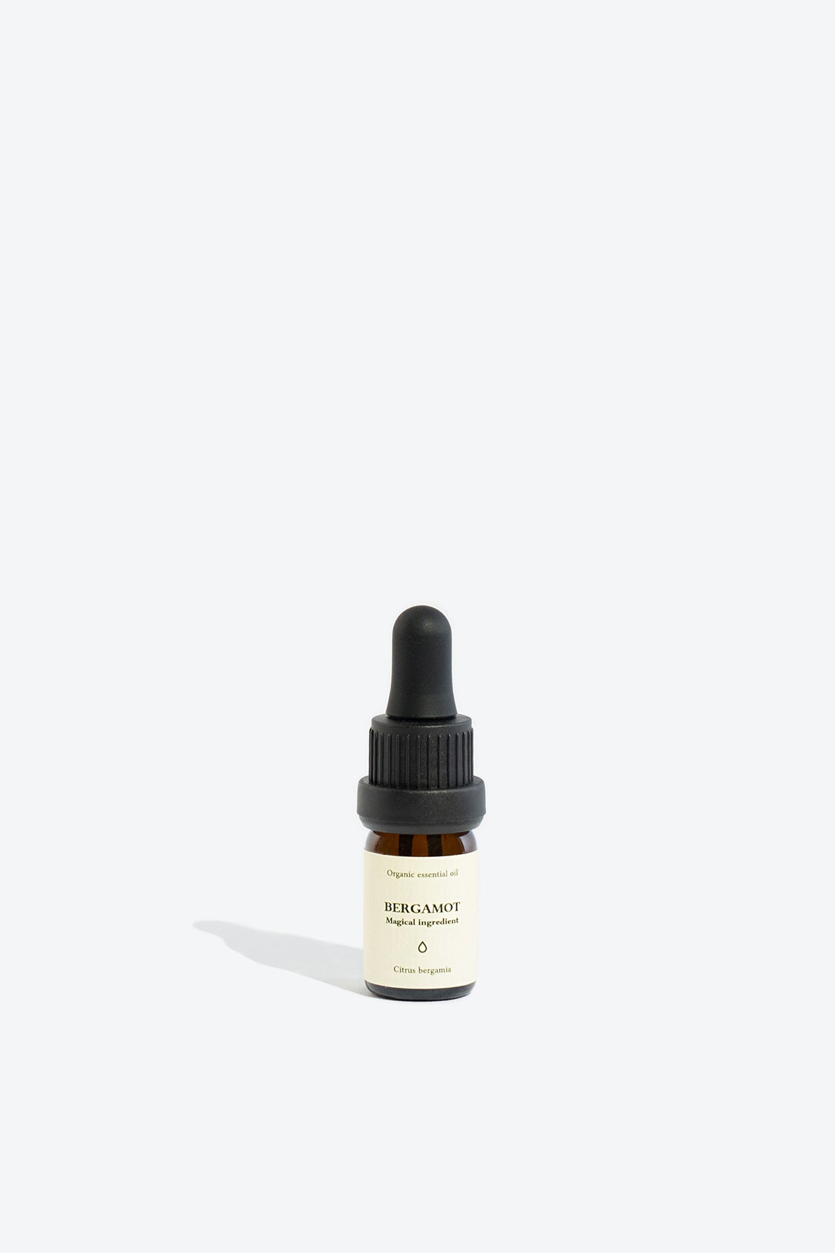 Close-up of BERGAMOT essential oil bottle and dropper