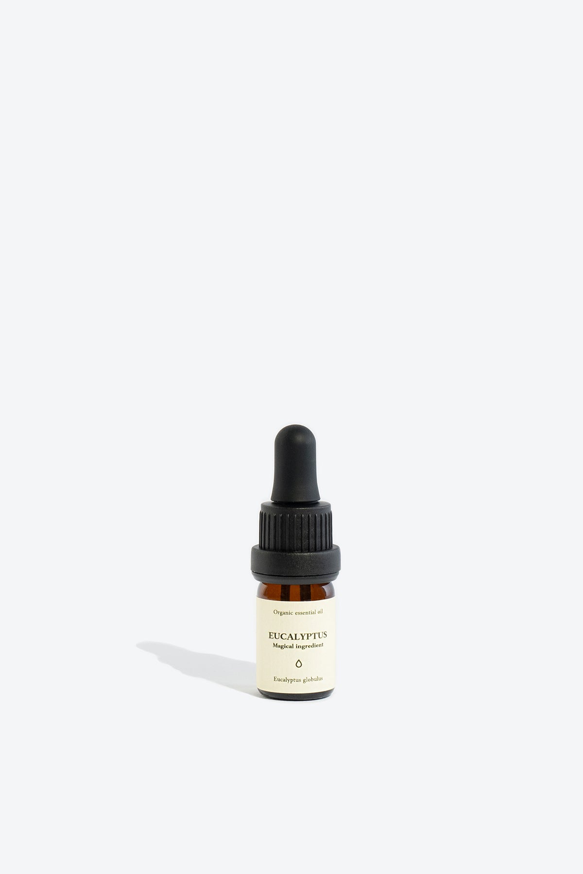 Eucalyptus essential oil bottle styled with ritual card