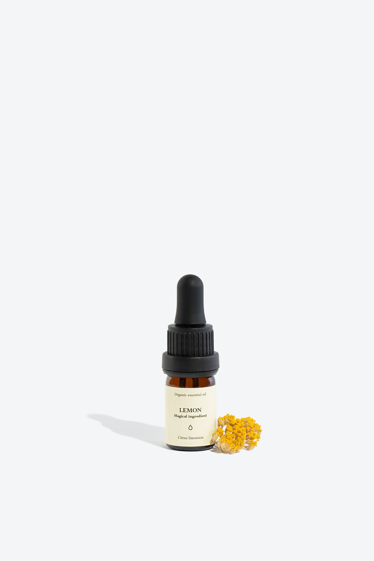 LEMON essential oil bottle, front view with label