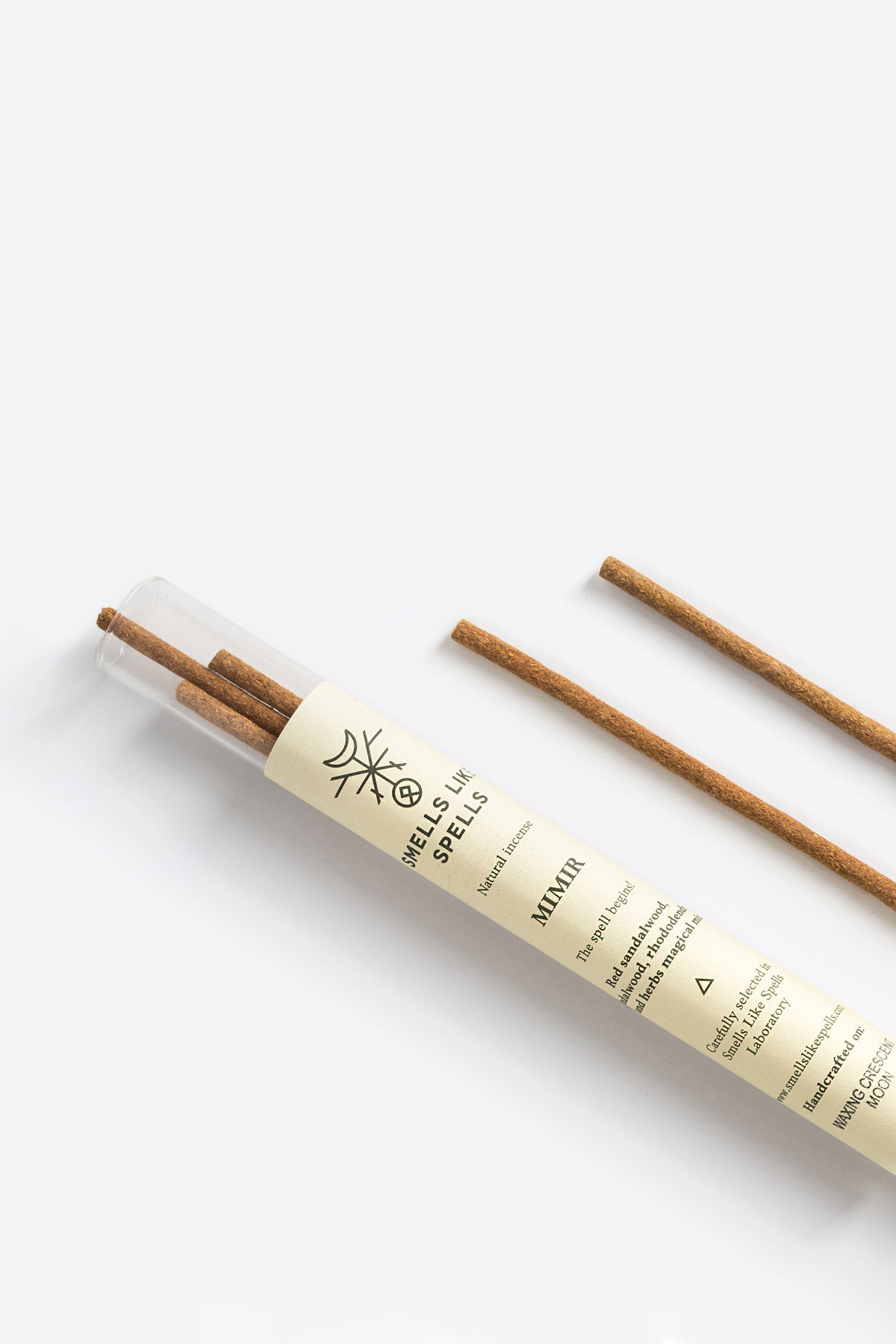 MIMIR incense stick burning with rising smoke