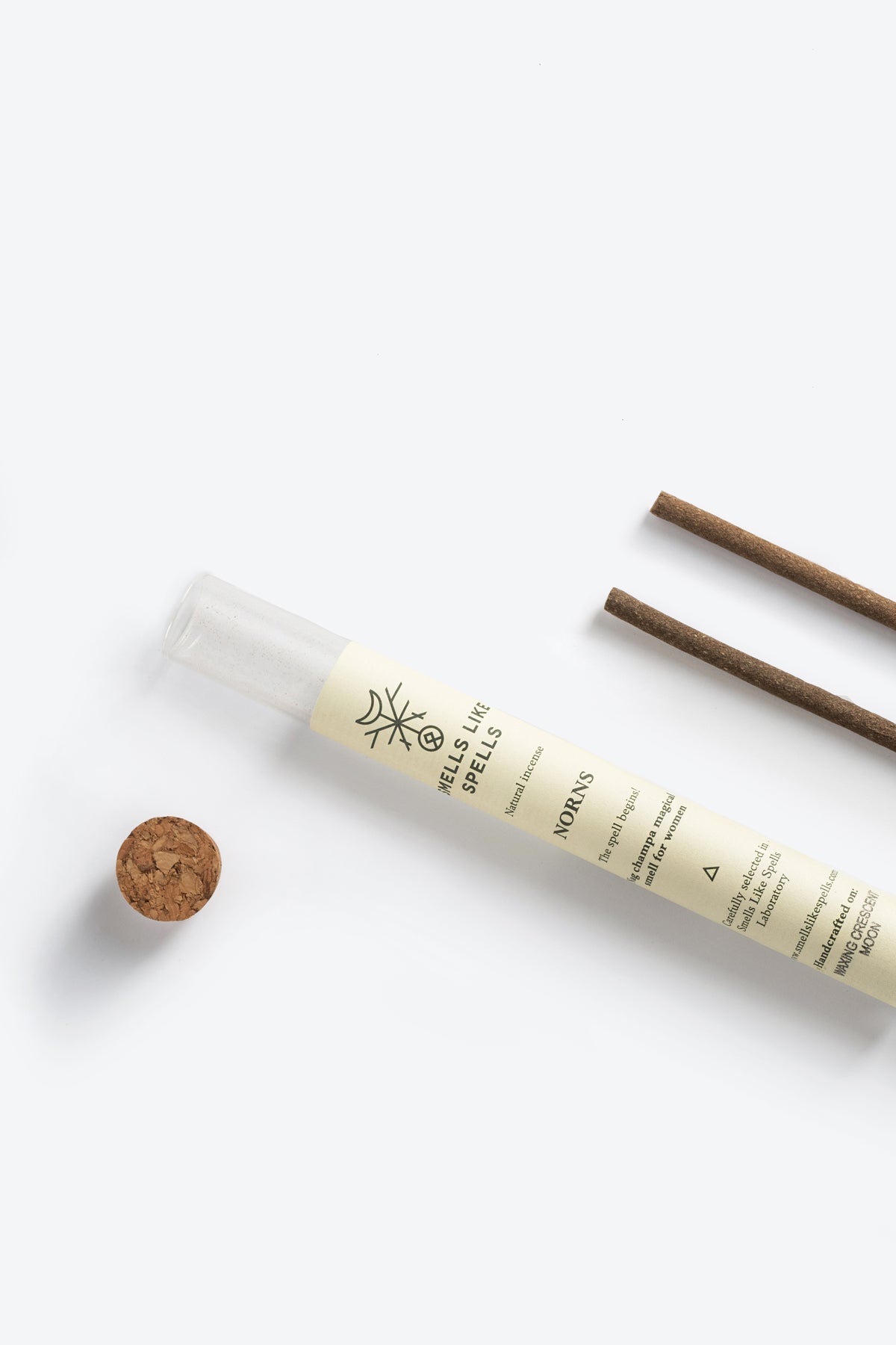 Natural Incense NORNS stick lit with rising smoke