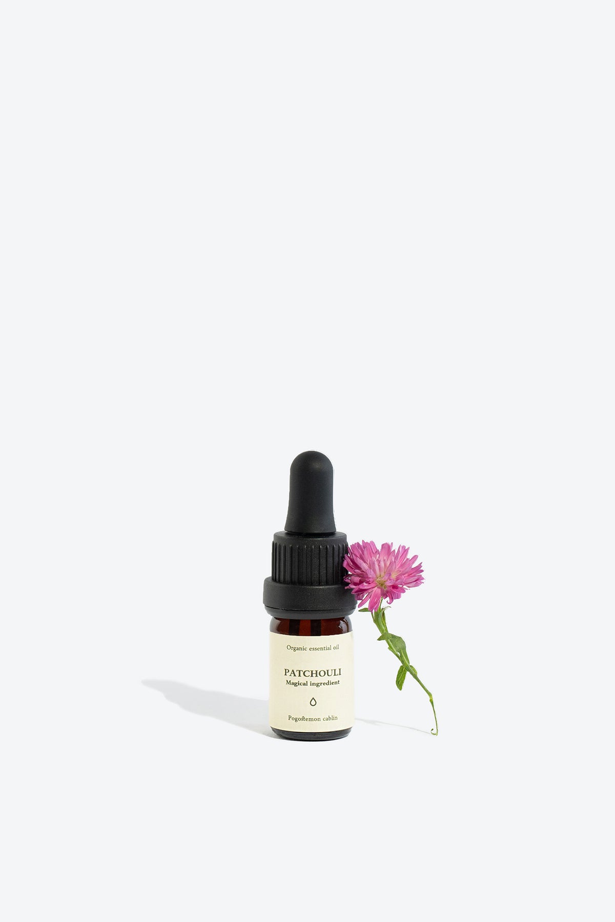 Patchouli essential oil bottle, front view