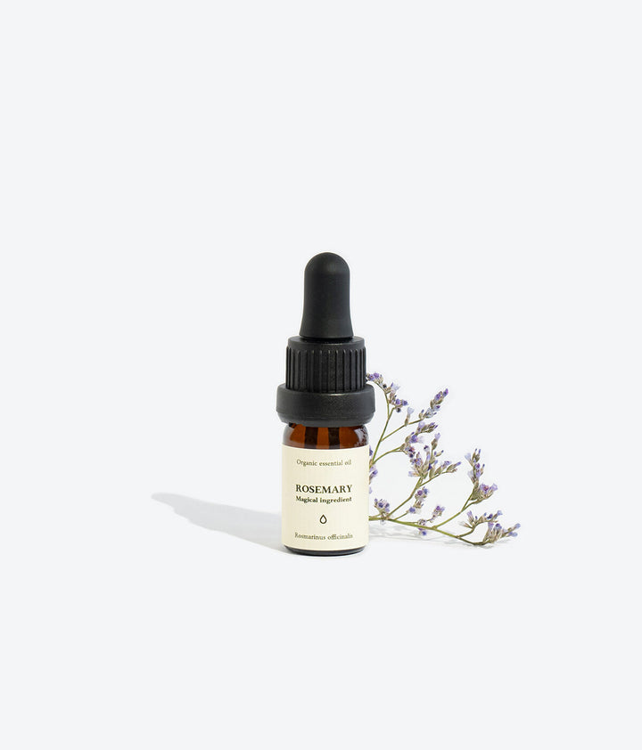 Rosemary essential oil bottle, front view