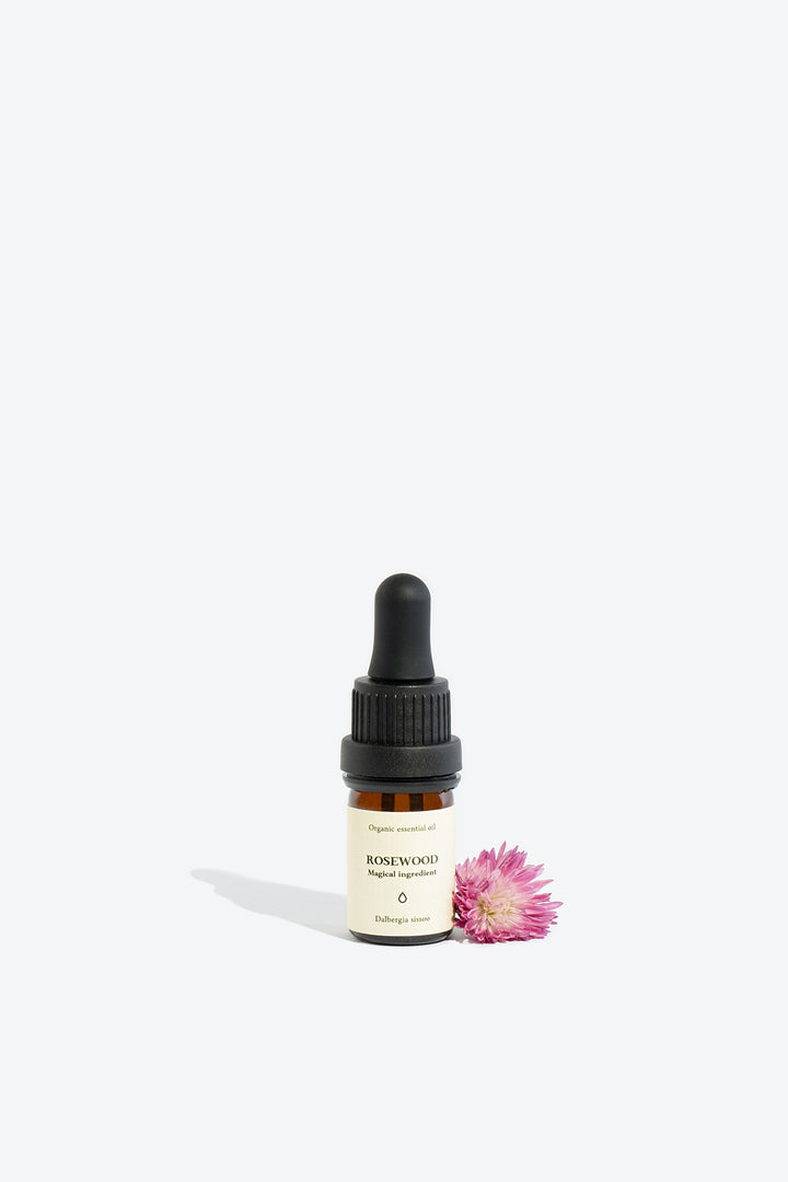 Rosewood essential oil bottle, front view