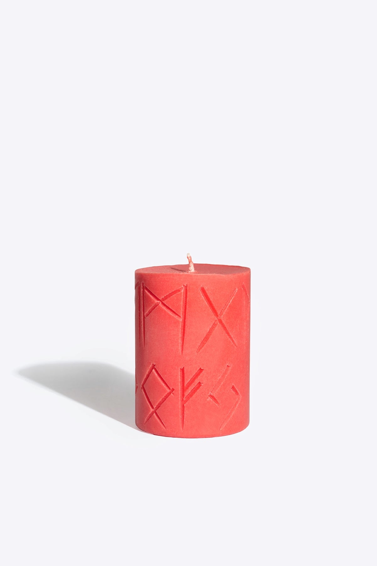 Close-up of FREYA rune candle wax and wick