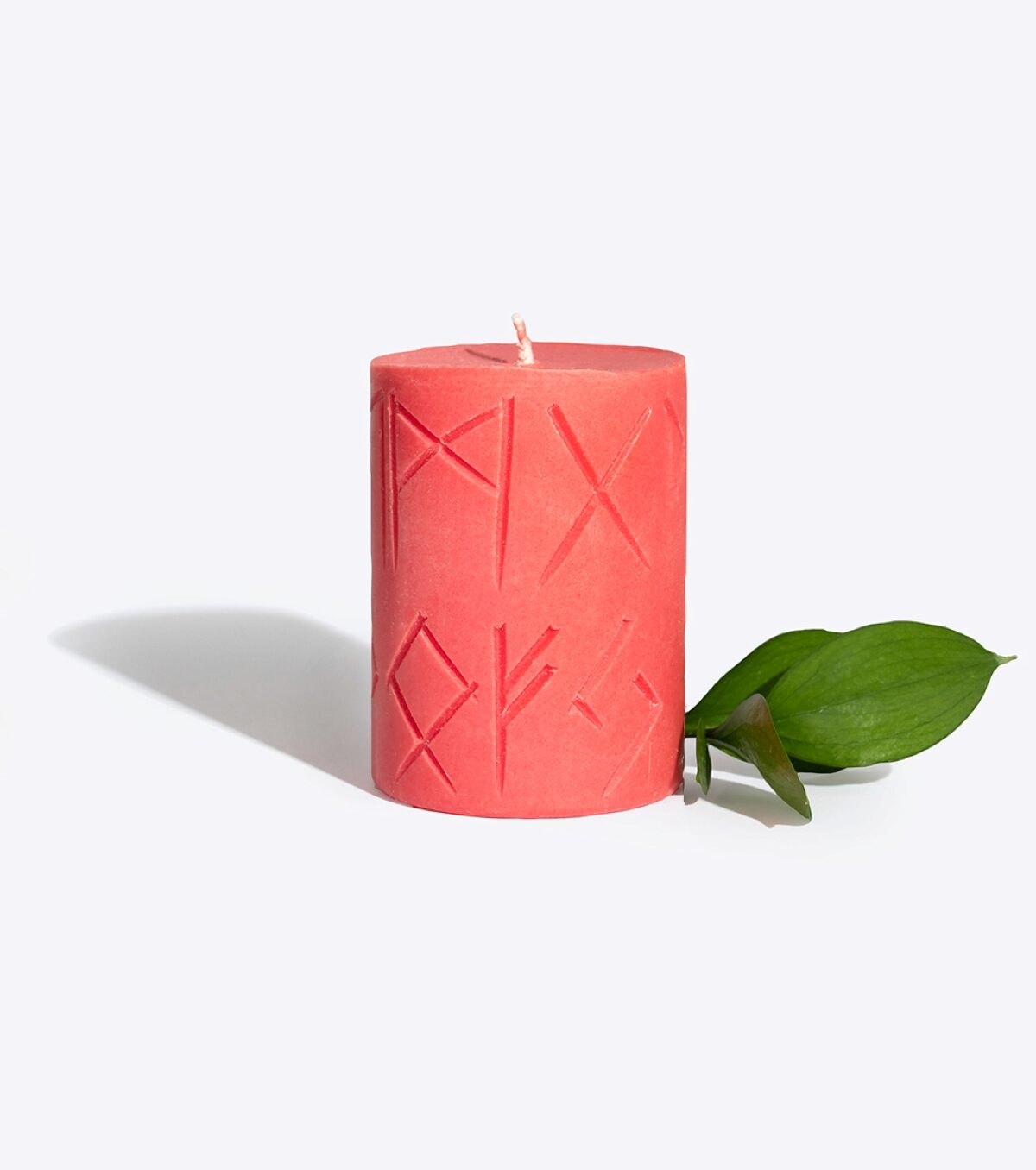 FREYA rune candle lit, warm glow for a love and attraction ritual