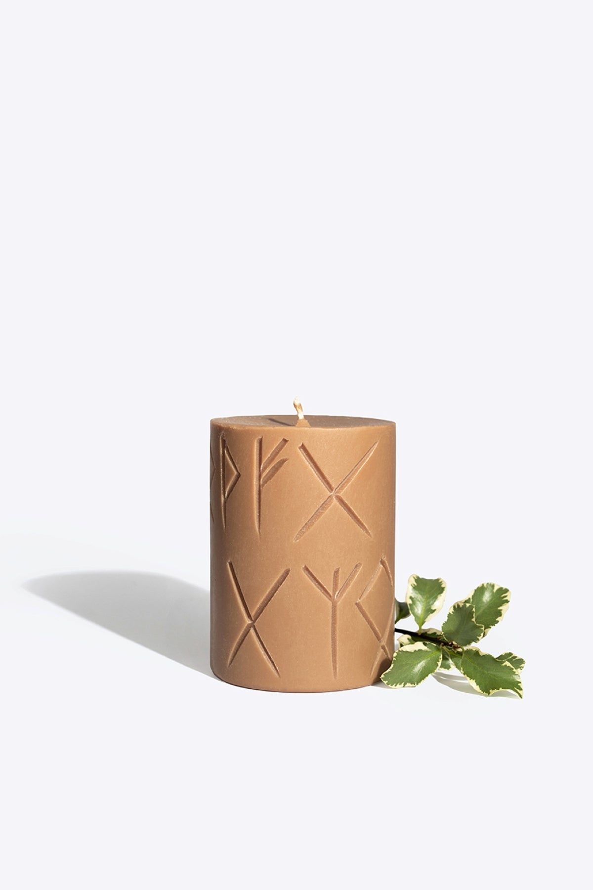 FRIGGA rune candle lit, warm glow for a home protection ritual