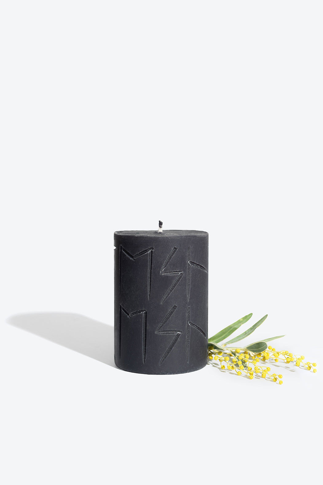 HEL rune candle lit, warm glow for a release and rebirth ritual