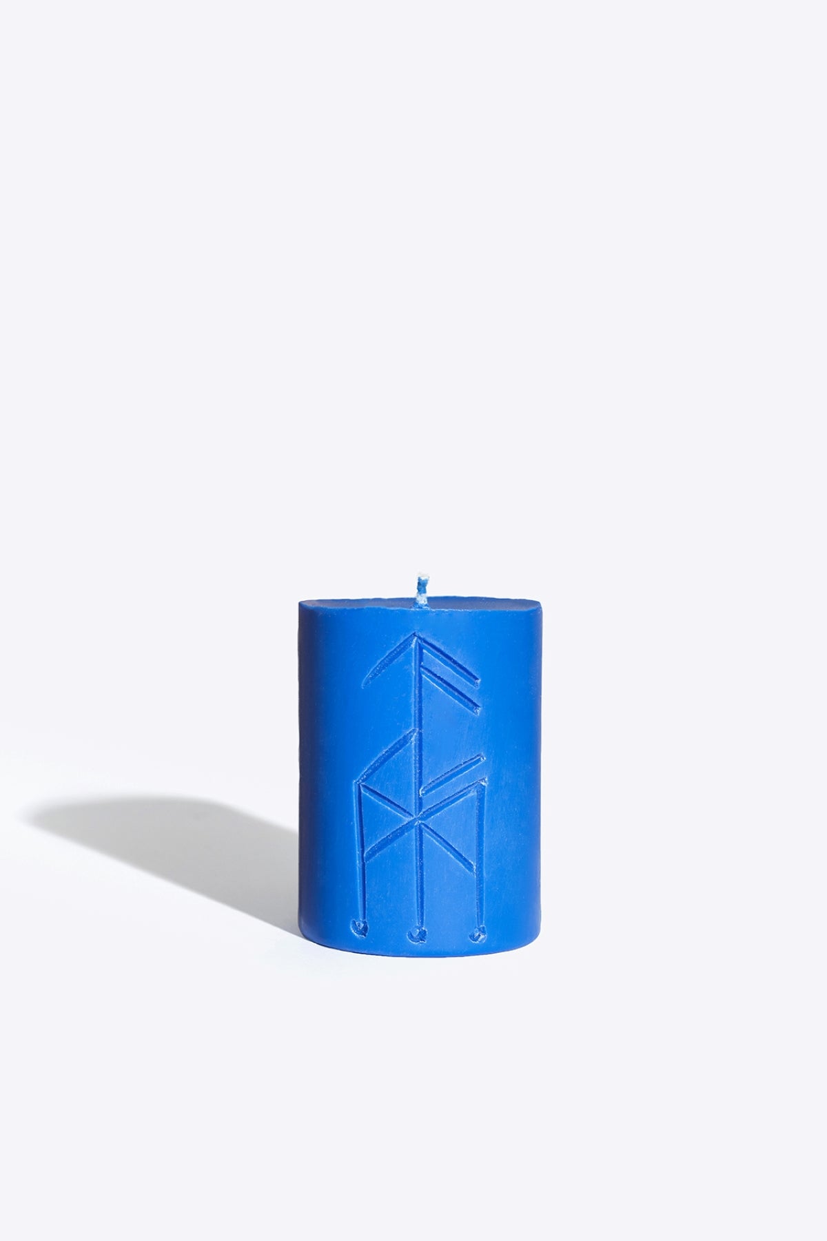 Close-up of THOR rune candle wax and wick