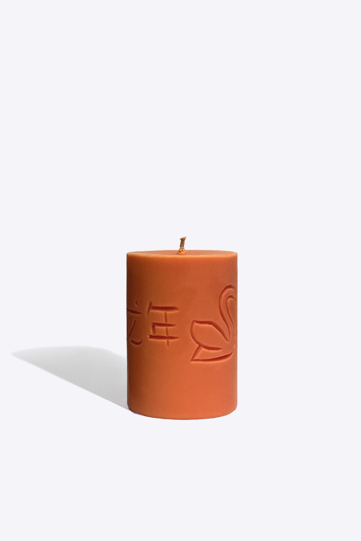 Close-up of Candle of the Year 2024 engraved rune and zodiac symbols