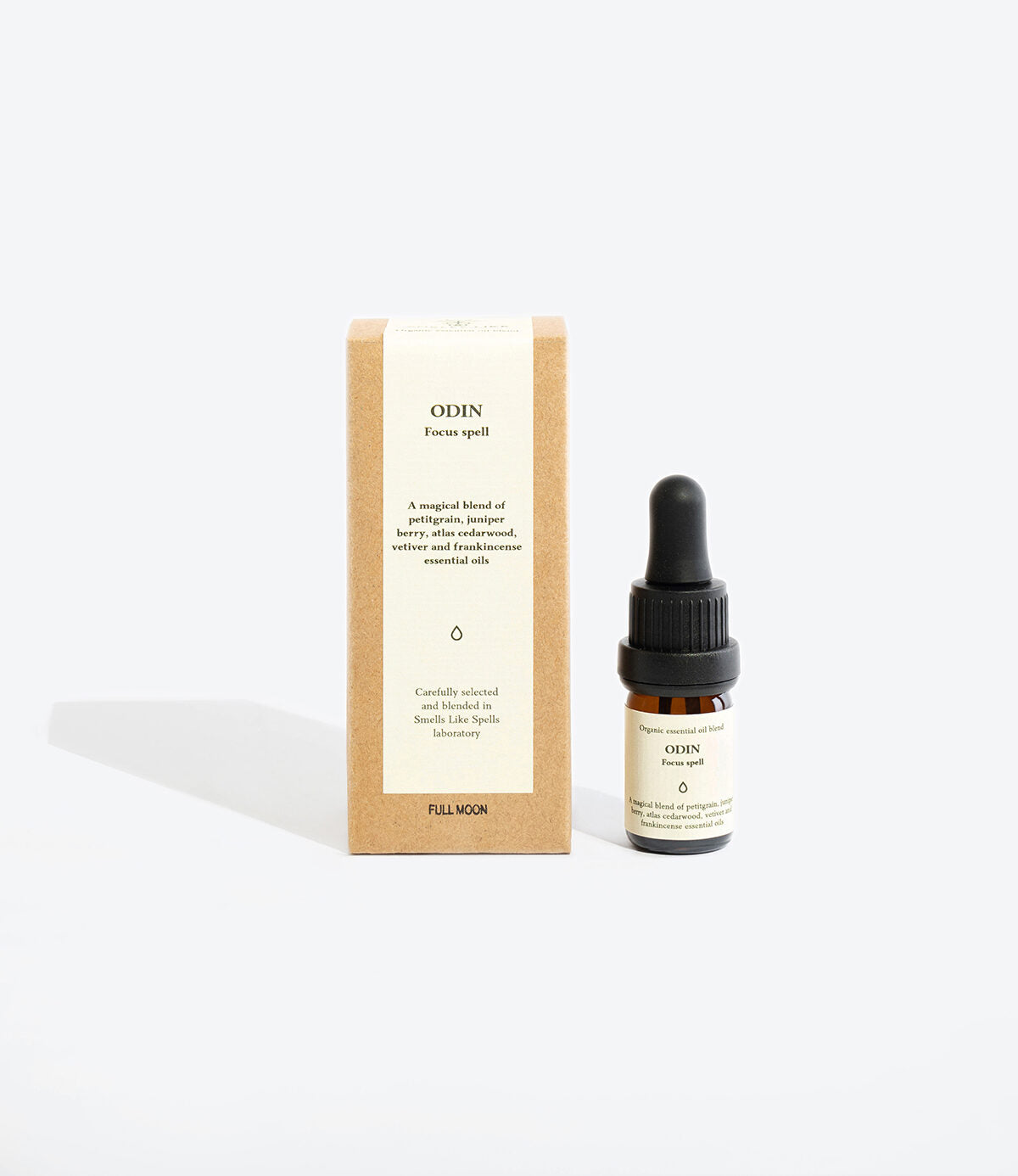 Close-up of ODIN essential oil blend pipette and glass bottle