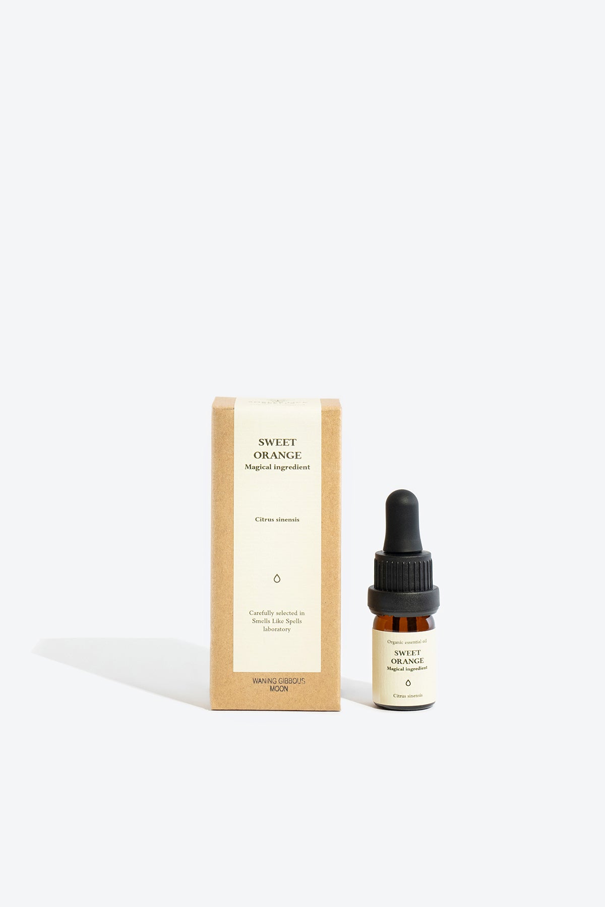 Close-up of SWEET ORANGE essential oil bottle and label