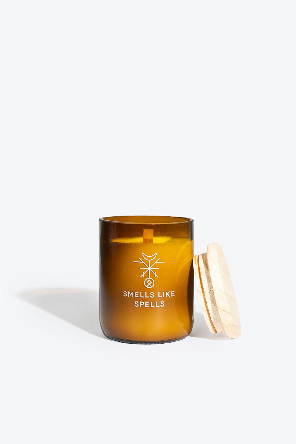 NORNS soy wax candle in amber glass jar, front view