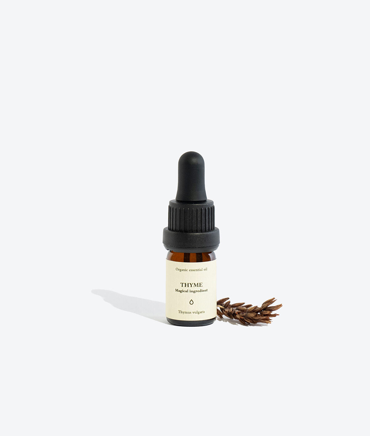 THYME essential oil bottle, front view with label