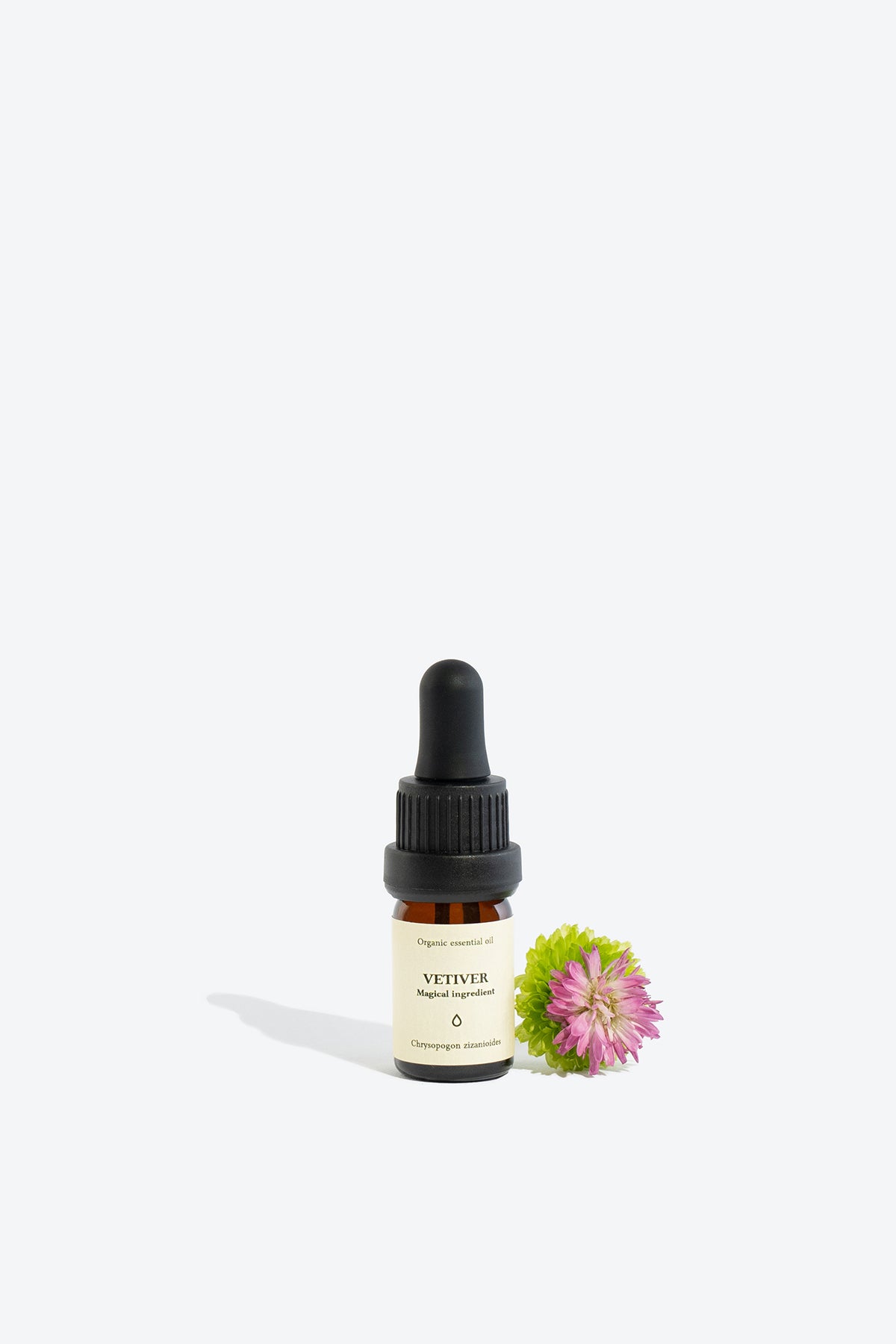 Vetiver essential oil bottle, front view